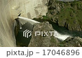 Reservoir dam with water stream 17046896