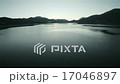 Drone view of a lake with sunset and sun appearing 17046897