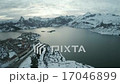 Lake in winter with snow and village 17046899