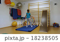 A young man using a hula hoop in her training in t 18238505