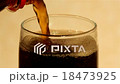Filling a glass with coke 18473925