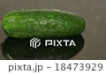 A cucumber on a black pan closeup 18473929