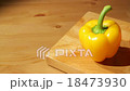 Two sweet peppers on a board 18473930