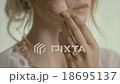 Blonde Bride applying Makeup with Ring 18695137