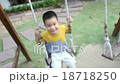 Asian baby boy playing on a swing and having fun 18718250