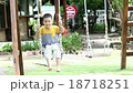 Asian baby boy playing on a swing and having fun 18718251