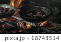 smoking of meet in open fire oven  18743514