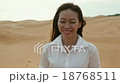 Asian woman smile outdoor desert wind blowing hair 18768511