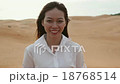 Asian woman smile outdoor desert wind blowing hair 18768514