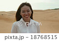 Asian woman smile outdoor desert wind blowing hair 18768515
