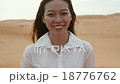 Asian woman smile outdoor desert wind blowing hair 18776762