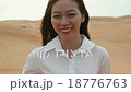 Asian woman smile outdoor desert wind blowing hair 18776763