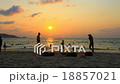 Men playing volleyball beside twilight beach,sport 18857021