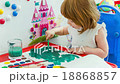 Little girl draws paints 18868857