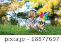 little boy with colored pinwheel 18877697