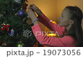 Little Girl Decorate Chrismass Tree 19073056