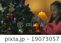 Little Girl Decorate Chrismass Tree Slider shoot 19073057