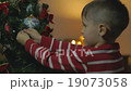 Little Boy Decorate Chrismass Tree 19073058