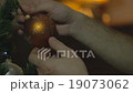Male Hands Decorate Christmass Tree 19073062