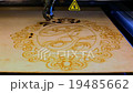 Laser machine cuts plywood pattern 19485662