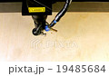 Laser beam engraving the dollar sign  19485684