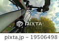 Cyclist in the autumn park on the shore of the pon 19506498