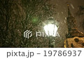 Warm Glow of Street Light Surrounded by Snowflakes 19786937