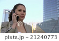 young business girl and talking on the phone with 21240773