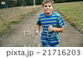 Child teen boy is running, jogging in jeans, sport 21716203