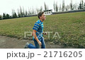 Child teen boy is running, jogging in jeans, sport 21716205