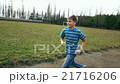 Child teen boy is running, jogging in jeans, sport 21716206