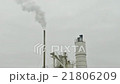 Smoke from chemical factory chimney over grey sky 21806209