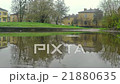 Rain drops dripping in a puddle. Slow motion 21880635
