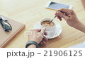 Cinemagraph of person mixing sugar in coffee cup 21906125