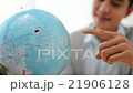 Cinemagraph of person spinning globe 21906128