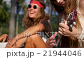 Young Hipster or Hippie Girls Playing Ukulele 21944046