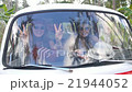 Stylish Hippie Girl Friends in Minivan on Road 21944052