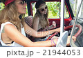 Hippie Girl Friends in Retro Vintage Minivan on a 21944053
