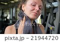 Tired Sporty Woman in Sweat with Thumbs Up at 21944720
