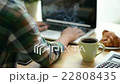 Cinemagraph of steaming coffee on desk of coder 22808435