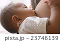 Mother breastfeeding her newborn baby 23746139