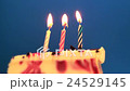 Happy Birthday cake with burning spiral candles 24529145