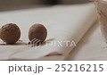 Woman Puts Confectioner Chocolate Balls on a 25216215