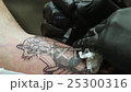 Tattoo Artist Does the Tattoo on the Man's Body. 25300316