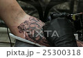 Tattoo Artist Does the Tattoo on His Hand Man. 25300318