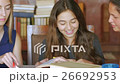 Young women learn with books & technology together 26692953