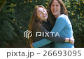 Two girl friends hug, smile and laugh in slowmo 26693095