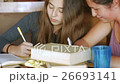 Two girls studying together and having a good time 26693141
