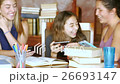 Teenage girls laughing with their mobile devices 26693147