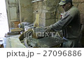 Carpenter Using Circular Saw cutting wood in 27096886